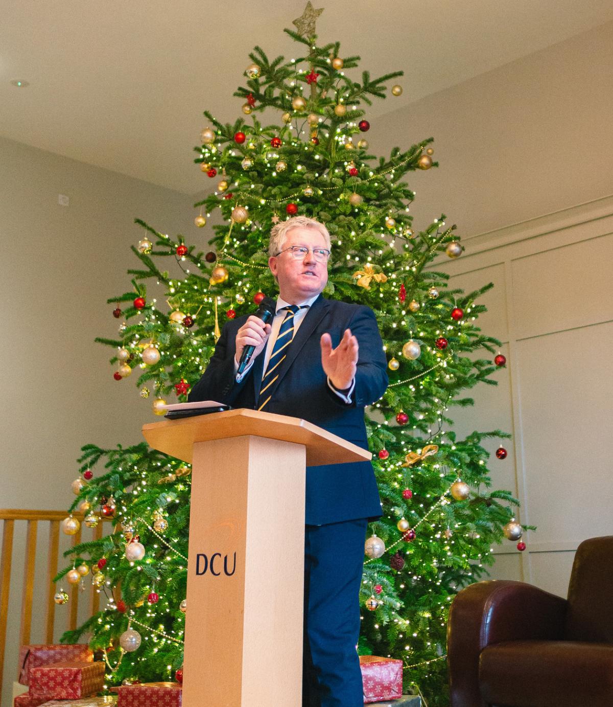 Daire Keogh speaking in front of Xmas tree