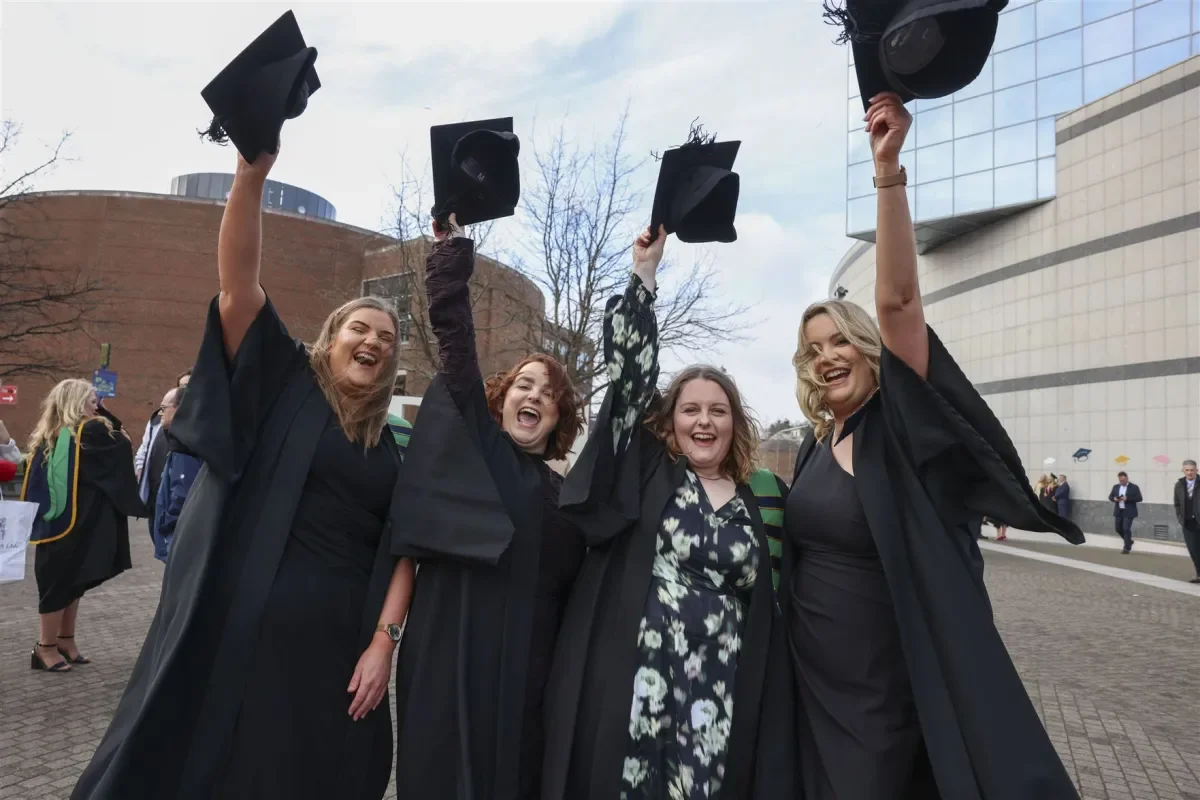 graduates throw their caps