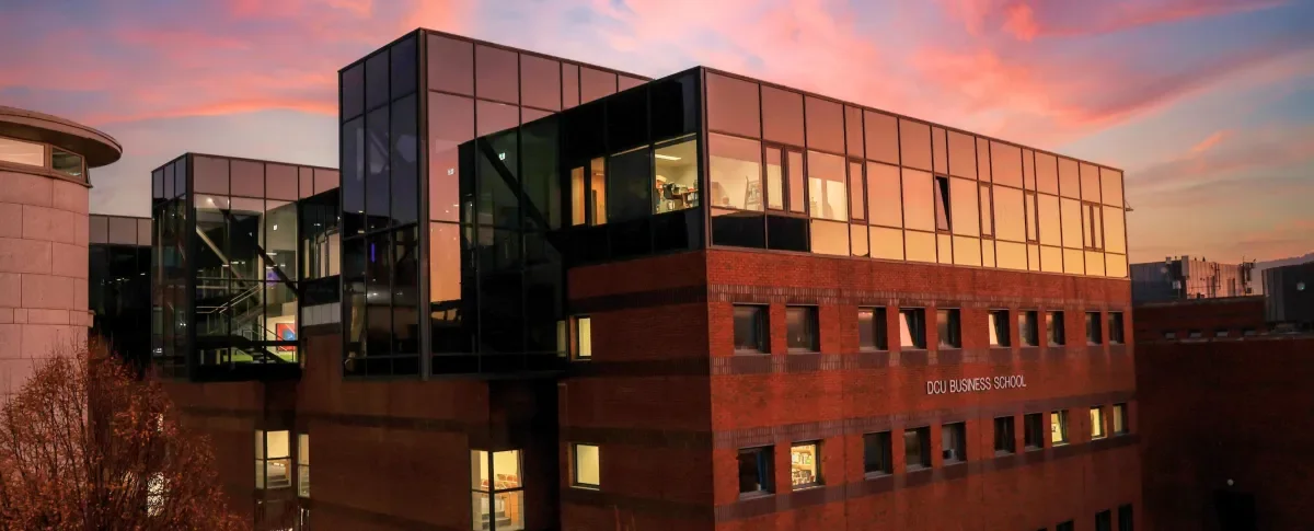 Shows DCU Business School at night