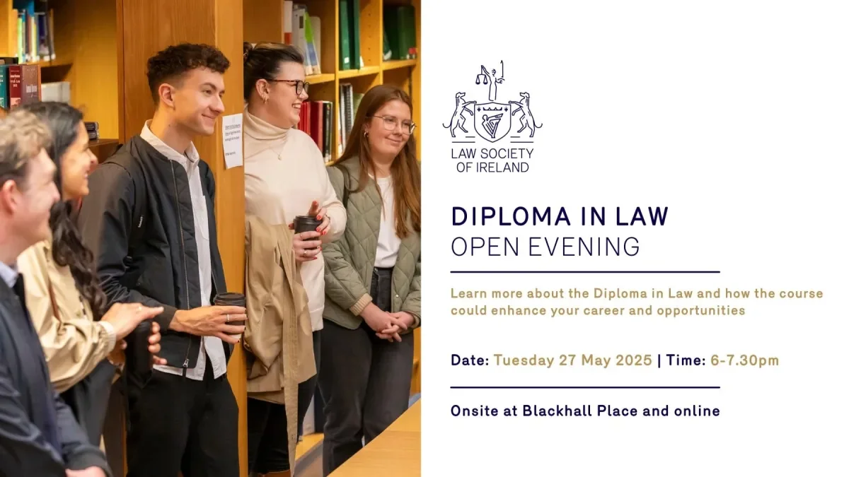 A group of prospective students taking part in the Diploma in Law tour at the Law Society of Ireland. The students are in the library, laughing as they listen to the tour facilitator.
