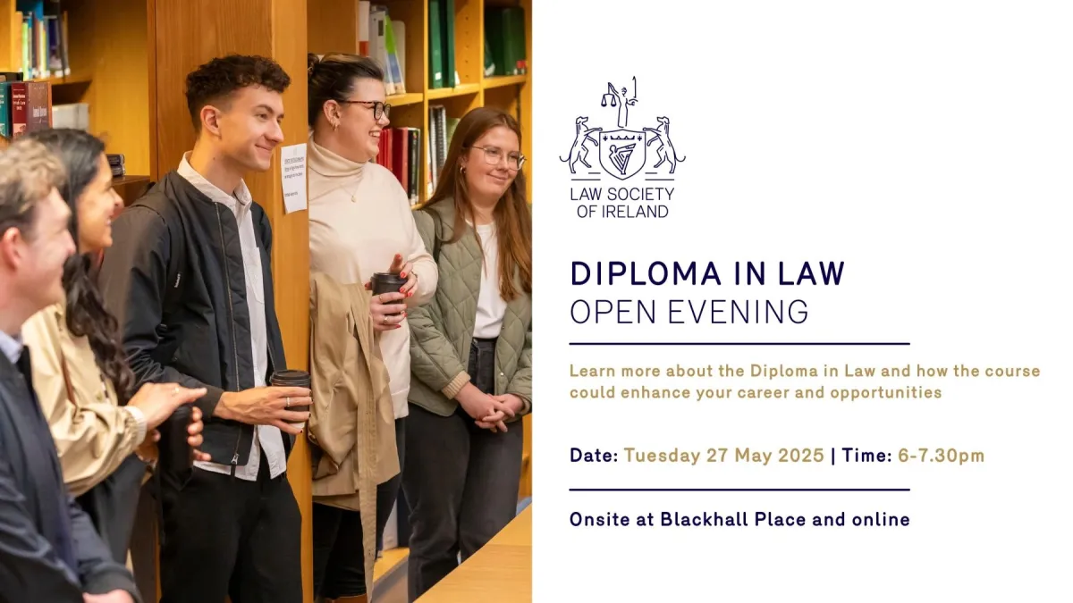A group of prospective students taking part in the Diploma in Law tour at the Law Society of Ireland. The students are in the library, laughing as they listen to the tour facilitator.