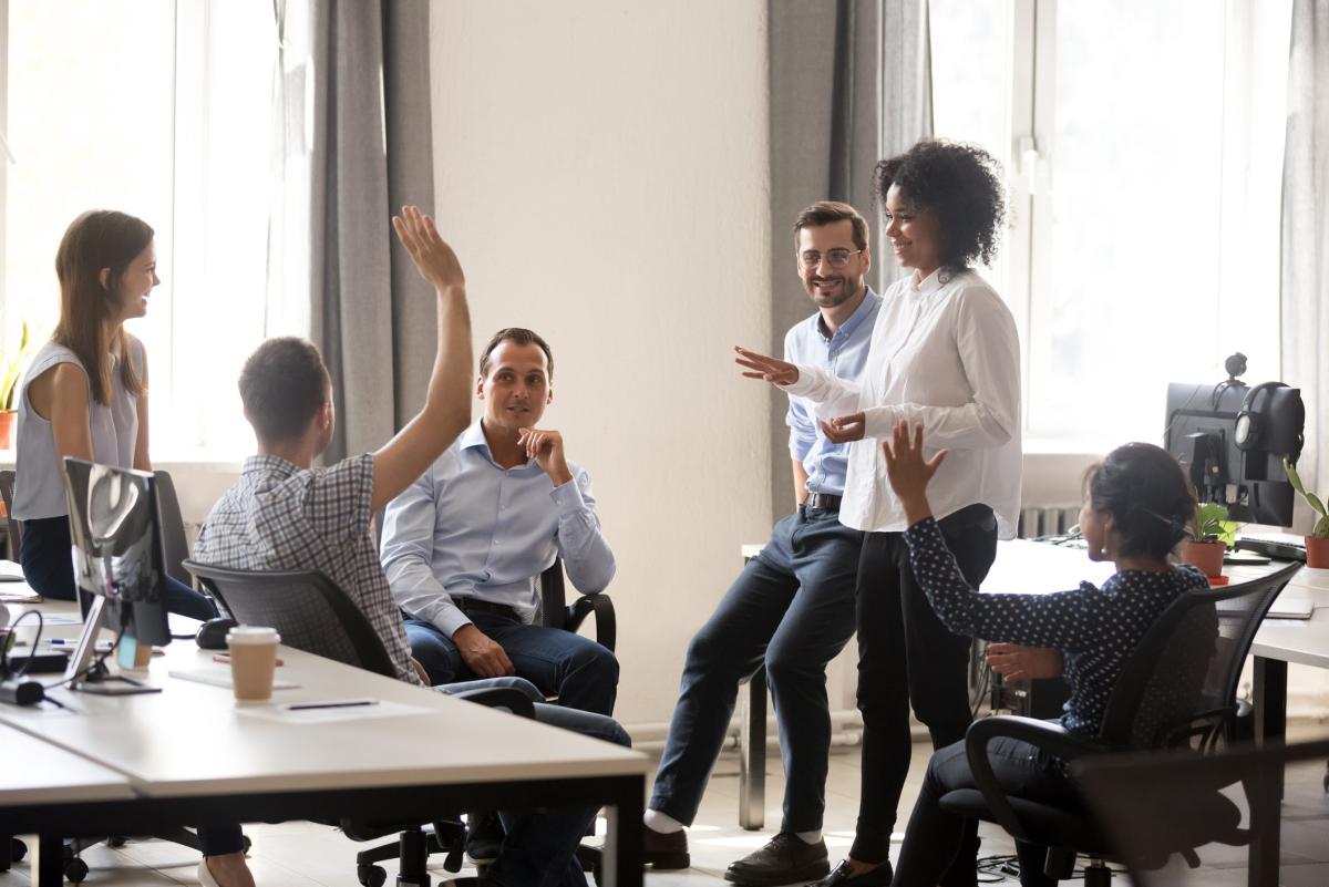 A group of people in a meeting