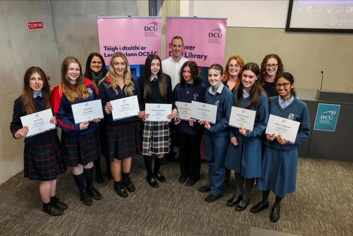 The History in Your Hands project team (Eilís O'Neill, Killian Downing, Hayley Brabazon and Celine Campbell) with the 2024 project finalists from Scoil Chaitríona, Trinity Comprehensive and Dominican College