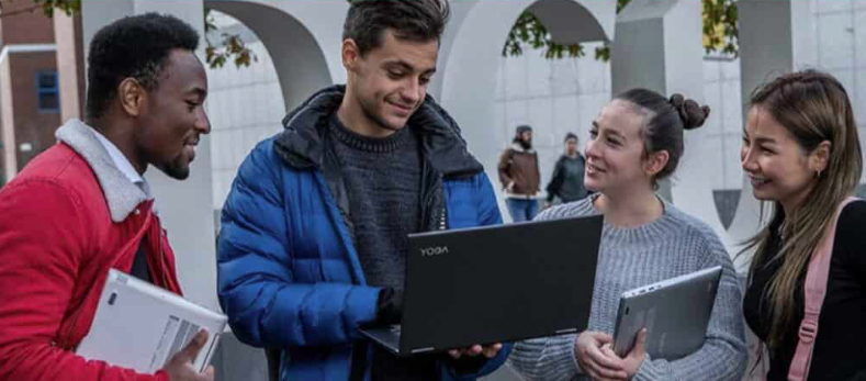A person and person looking at a computer