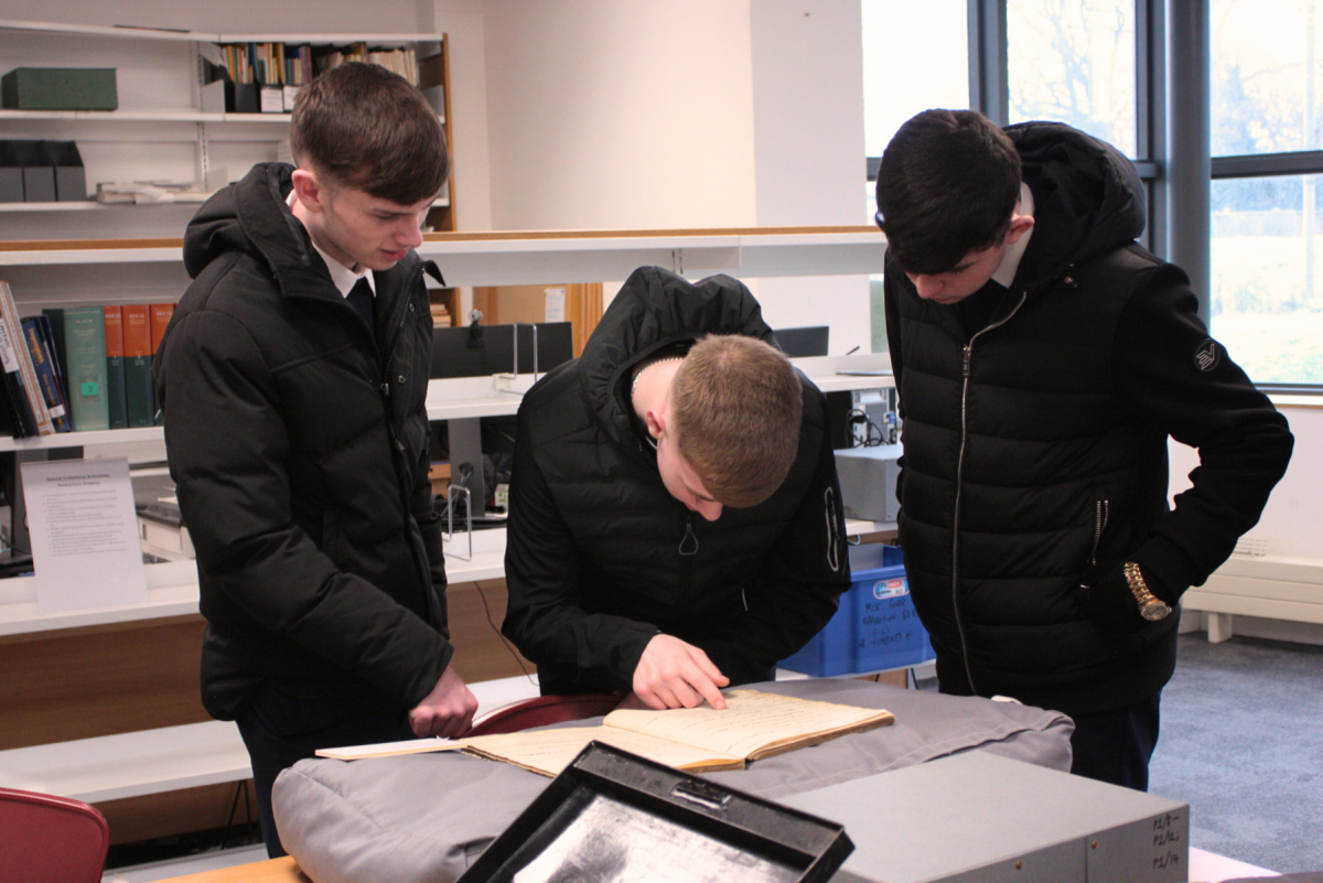 Students from Trinity Comprehensive Ballymun examine the Seán Lester diaries