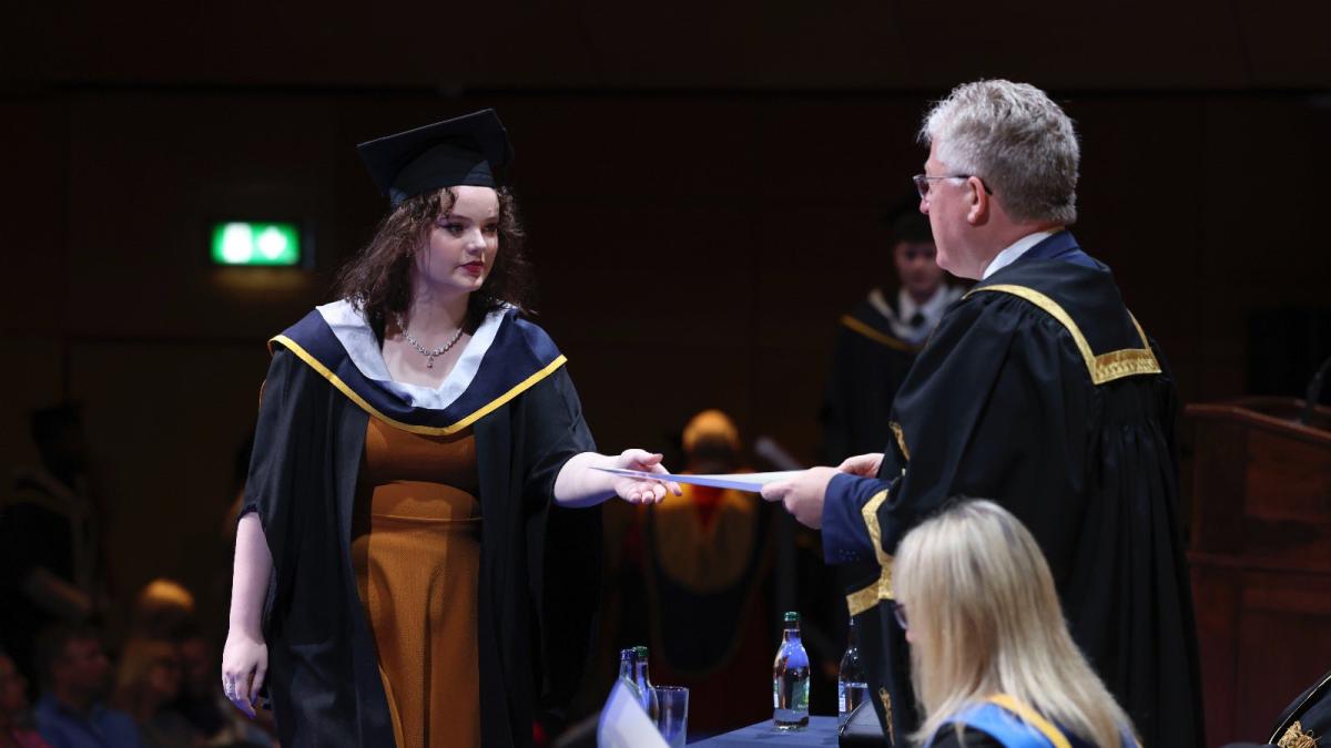 Graduate receives their parchment from Prof Daire Keogh, President of Dublin City University