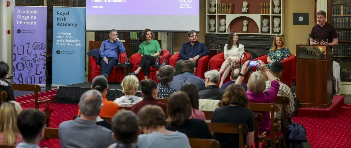 Shows DCU Research Impact speakers on stage at the Royal Irish Academy