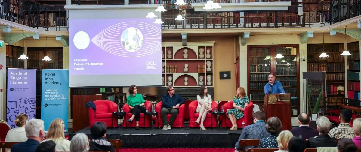 Shows DCU Research Impact speakers on stage at the Royal Irish Academy