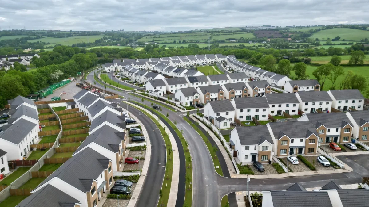 Shows aerial view of new Irish housing development