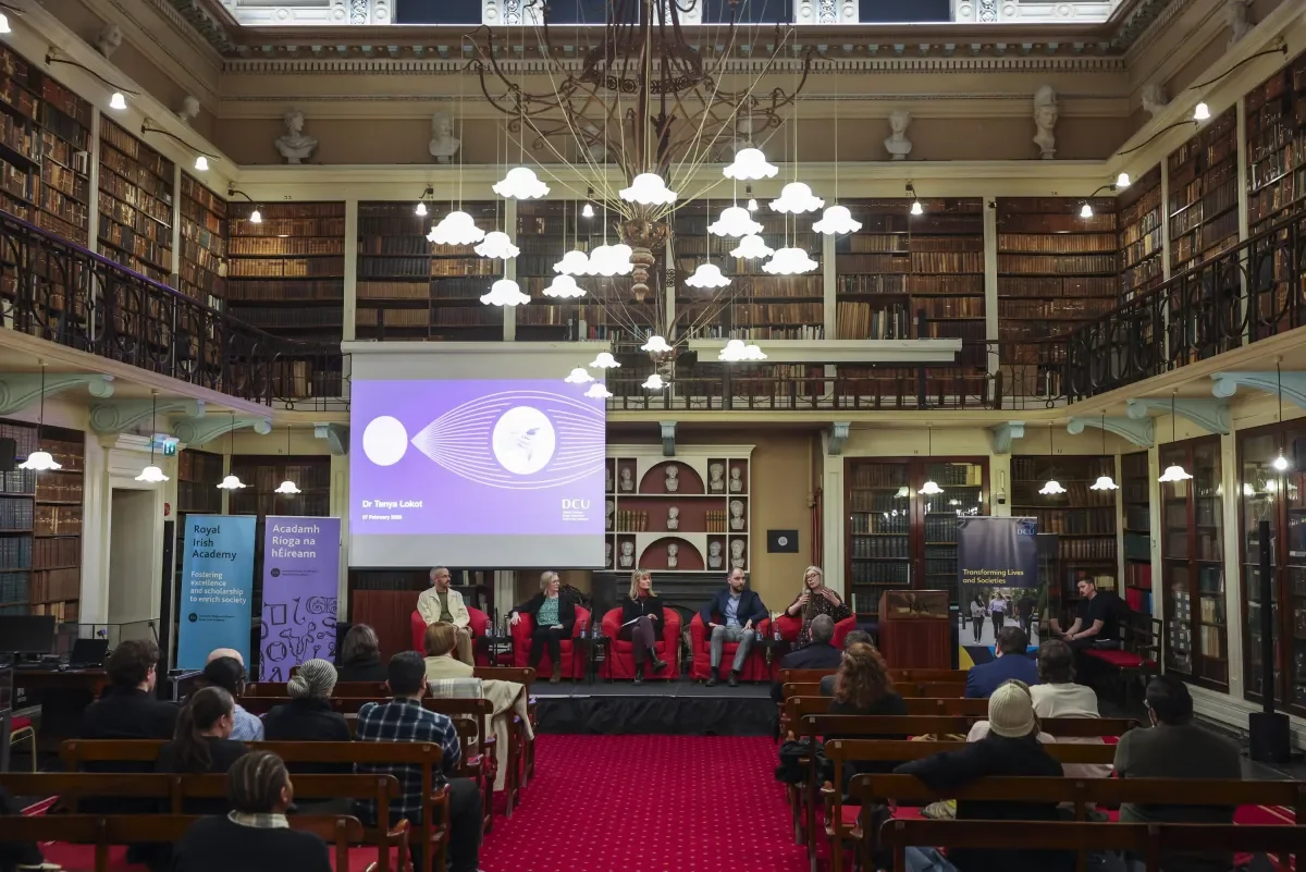 Image of people attending a discussion panel 