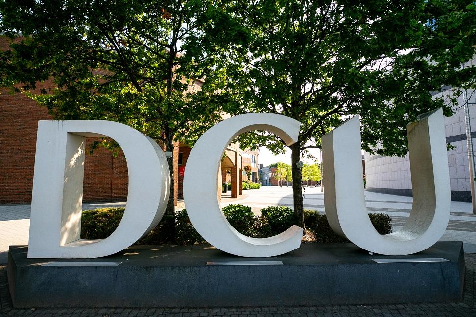 A photograph of the DCU logo arch on campus. 