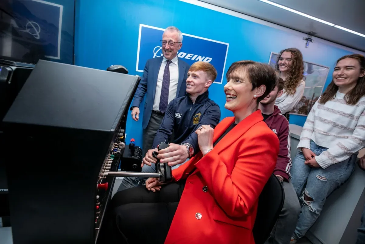Minister Norma Foley with students and Sir Martin Donnelly, president of Boeing Europe and managing director of Boeing in the UK and Ireland.