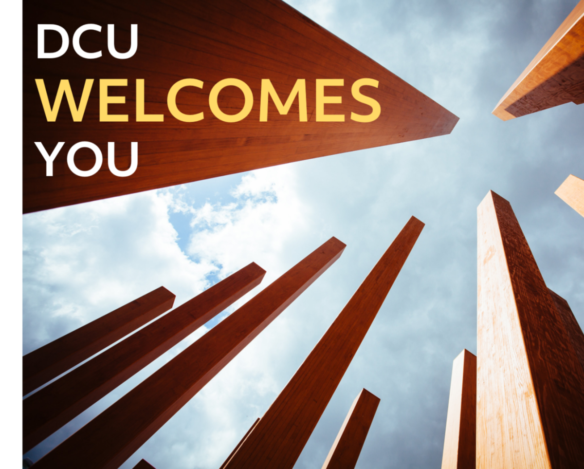 DCU Welcomes You written on image of columns and the sky
