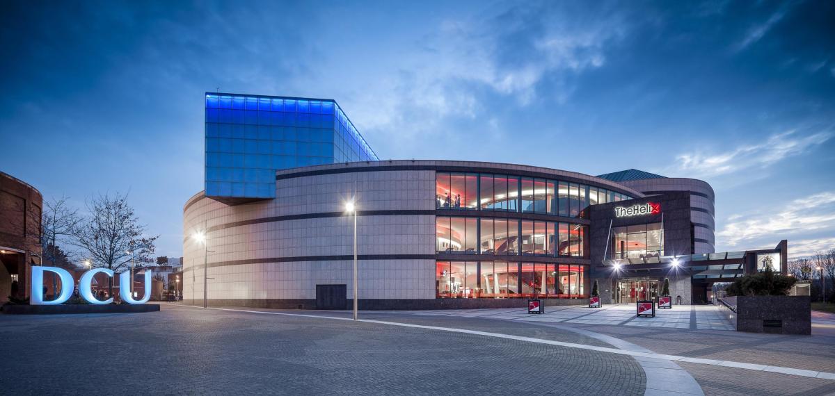 photo of DCU letters' sculpture and the Helix at dusk