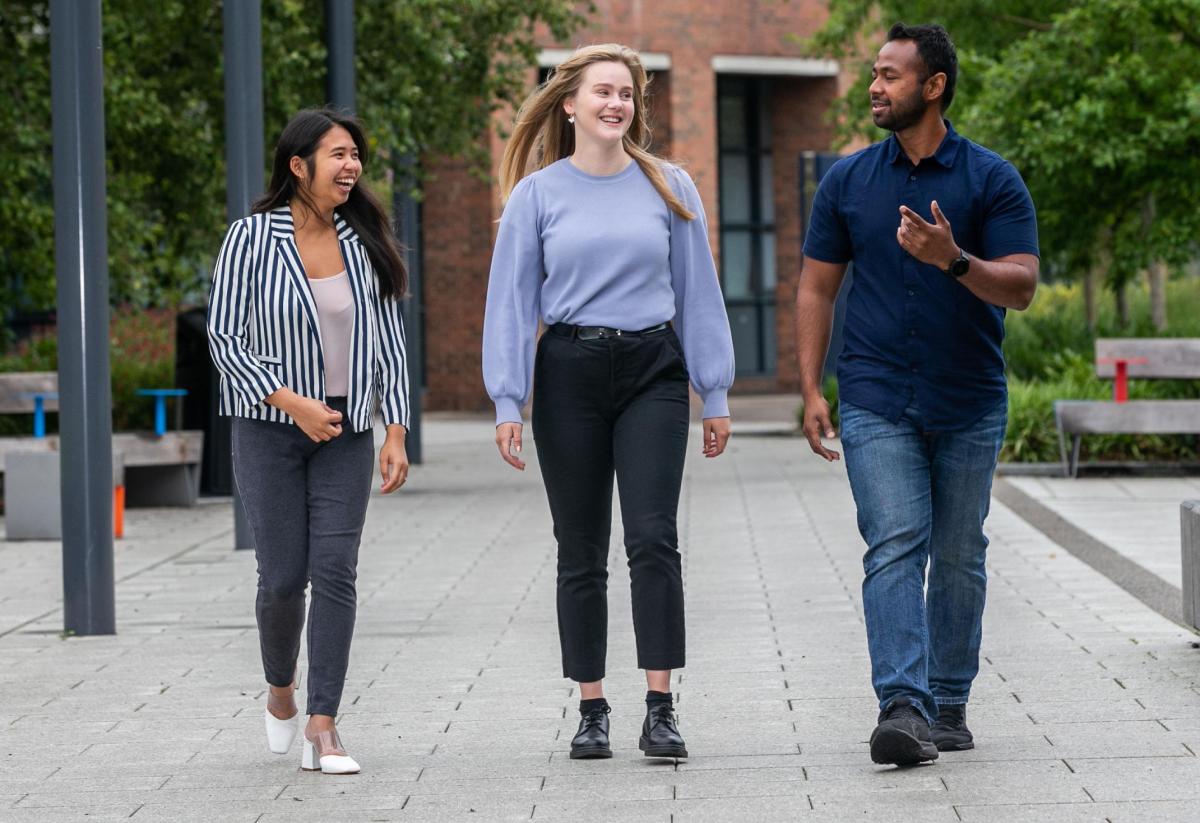 picture of postgrad students walking on campus