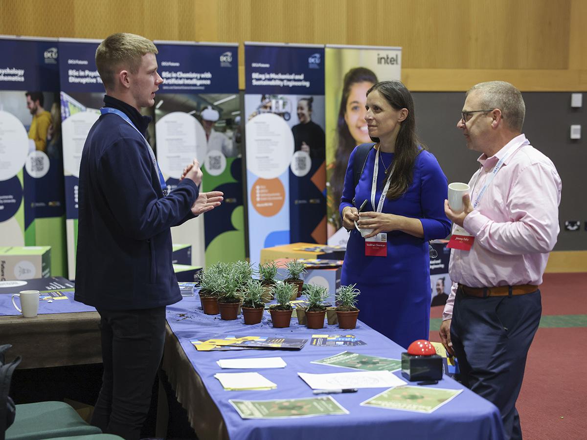 Stephen Murnane (1st year Global Challenges student) interacting with attendees at the DCU stand.