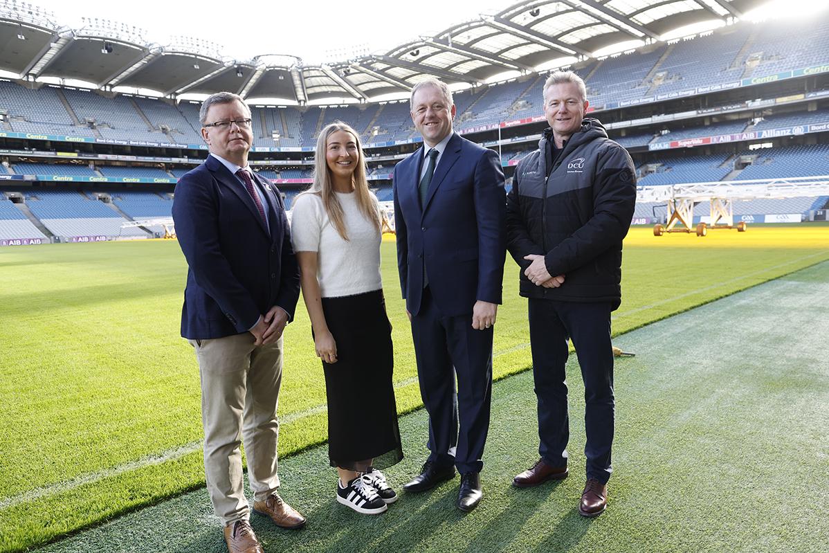 Uachtarán an Cumann Camógaíochta Brian Molloy; Sophie Cotter, who plays for Naomh Mearnóg and studies at DCU; Thomas Byrne TD, Minister of State for Sport, Physical Education and the Gaeltacht; and DCU Director of Sport James Galvin.
