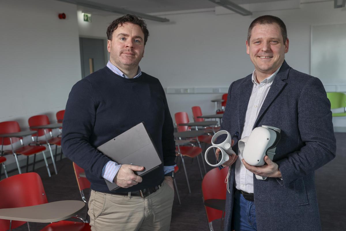 Shows Dr Peter Tiernan and Dr Alan Gorman posing with VR equipment