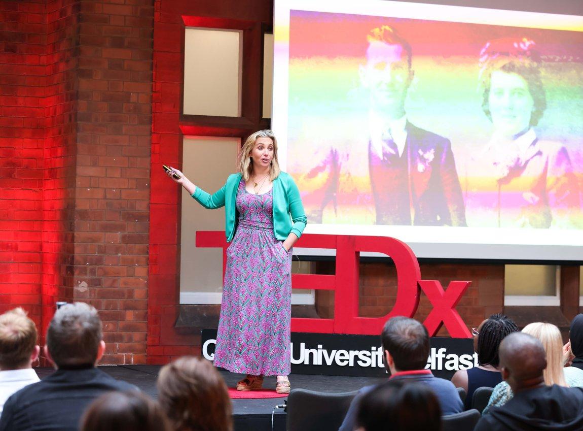 Shows Dr Fiona Murphy speaking on stage at a TedX event at Queen's University Belfast