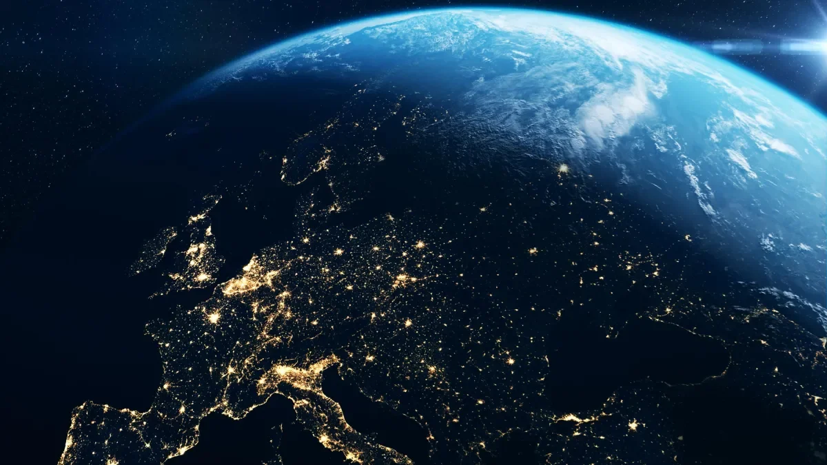 Shows space image of satellite orbiting earth