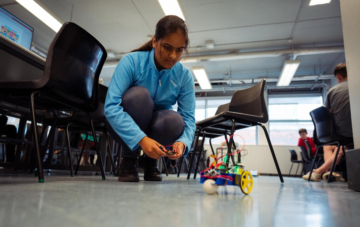 Student works with autonomous vehicle