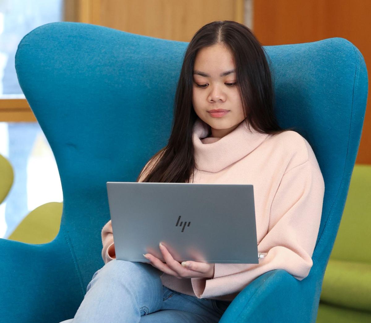 Student works on a laptop