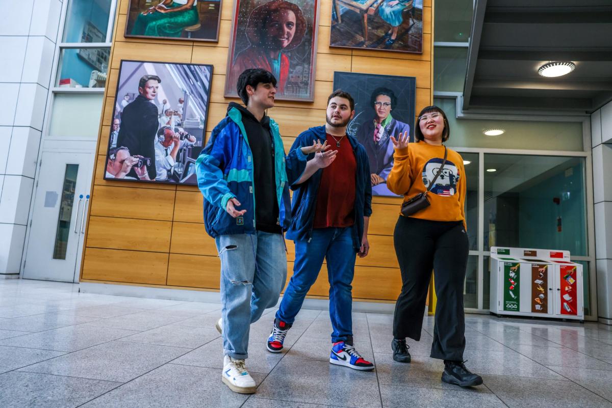 Students walk in the Stokes Foyer
