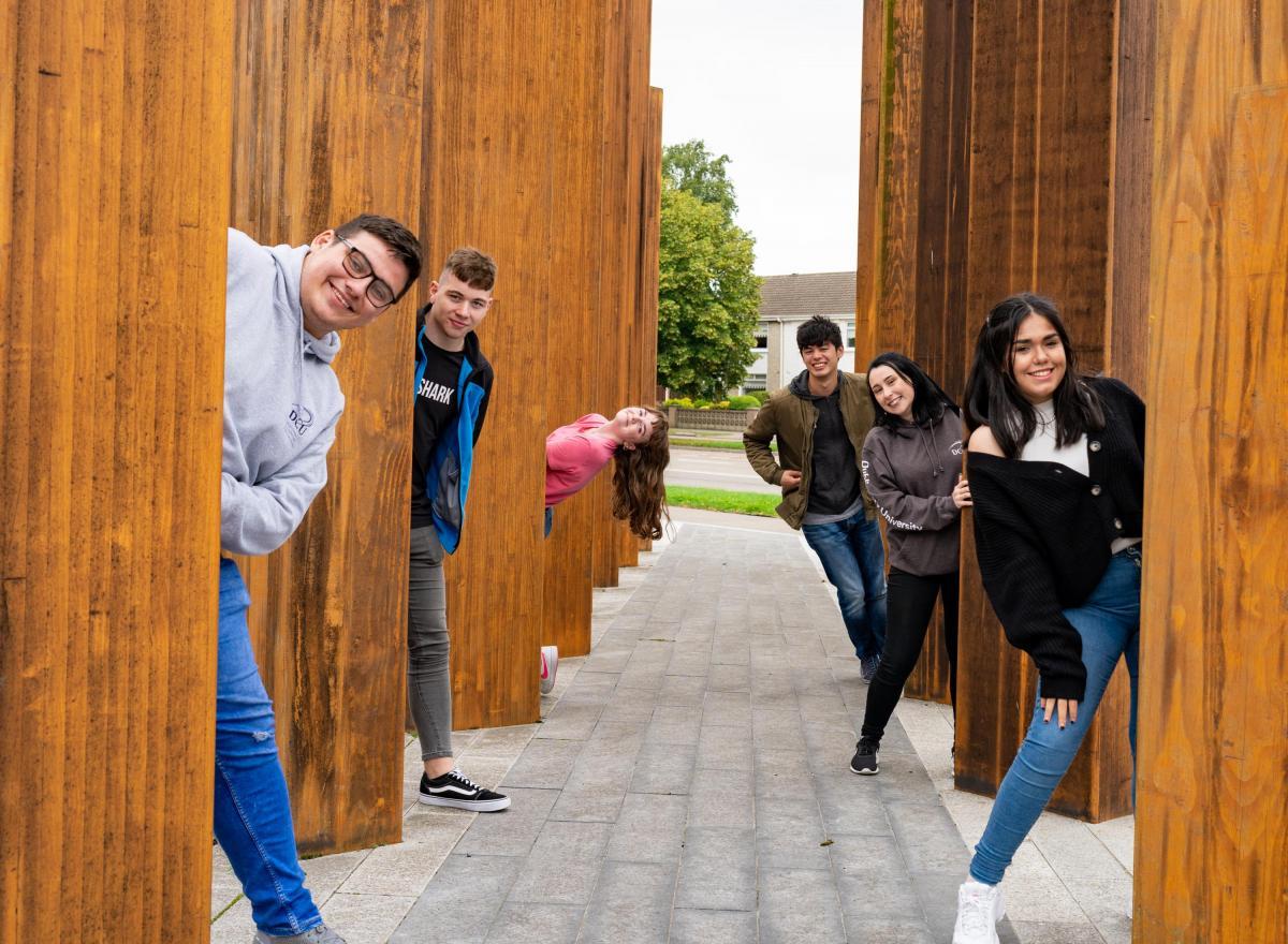 Image of DCU Student Ambassadors posing at the DCU Collins Avenue Entrance