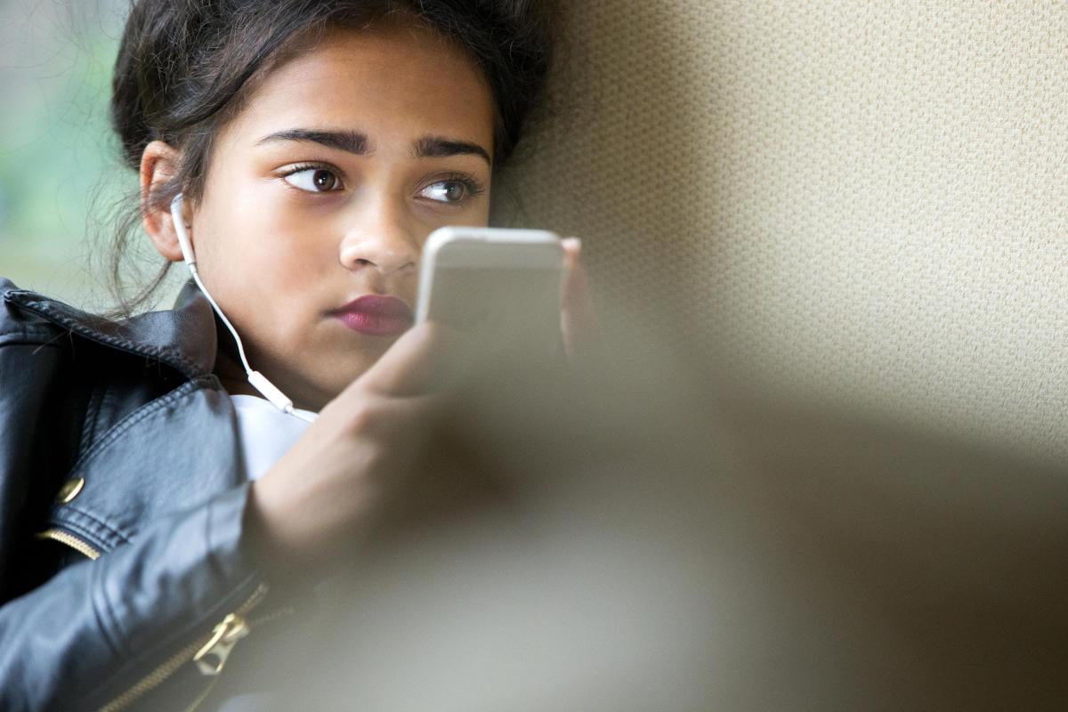 Image of young girl using a phone