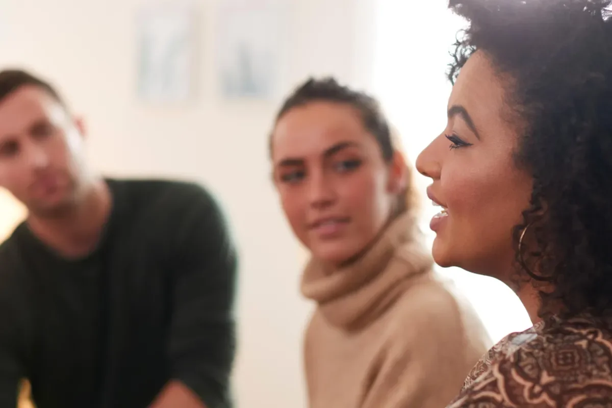 Image of people talking to eachother in a group