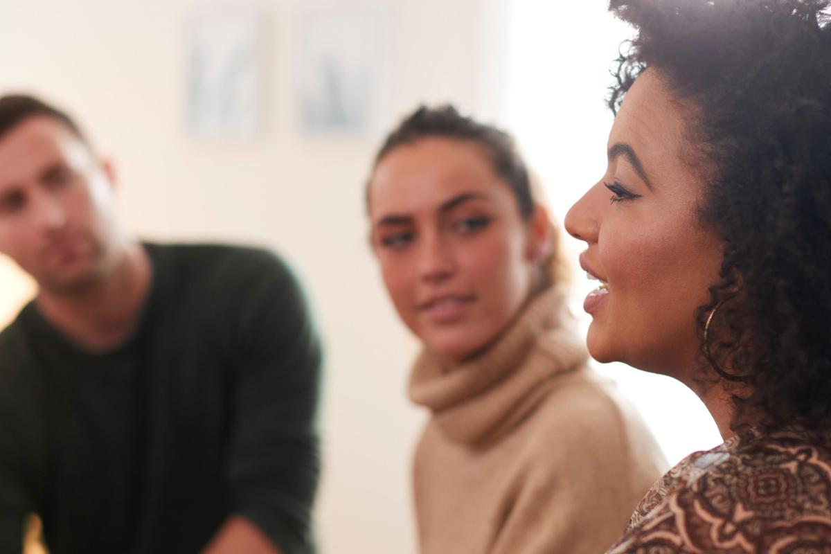 Image of people talking to eachother in a group