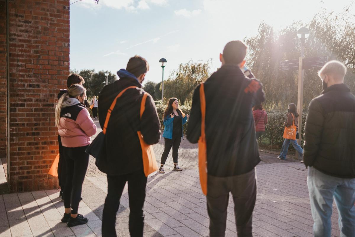 This image shows prospective students attending a campus tour