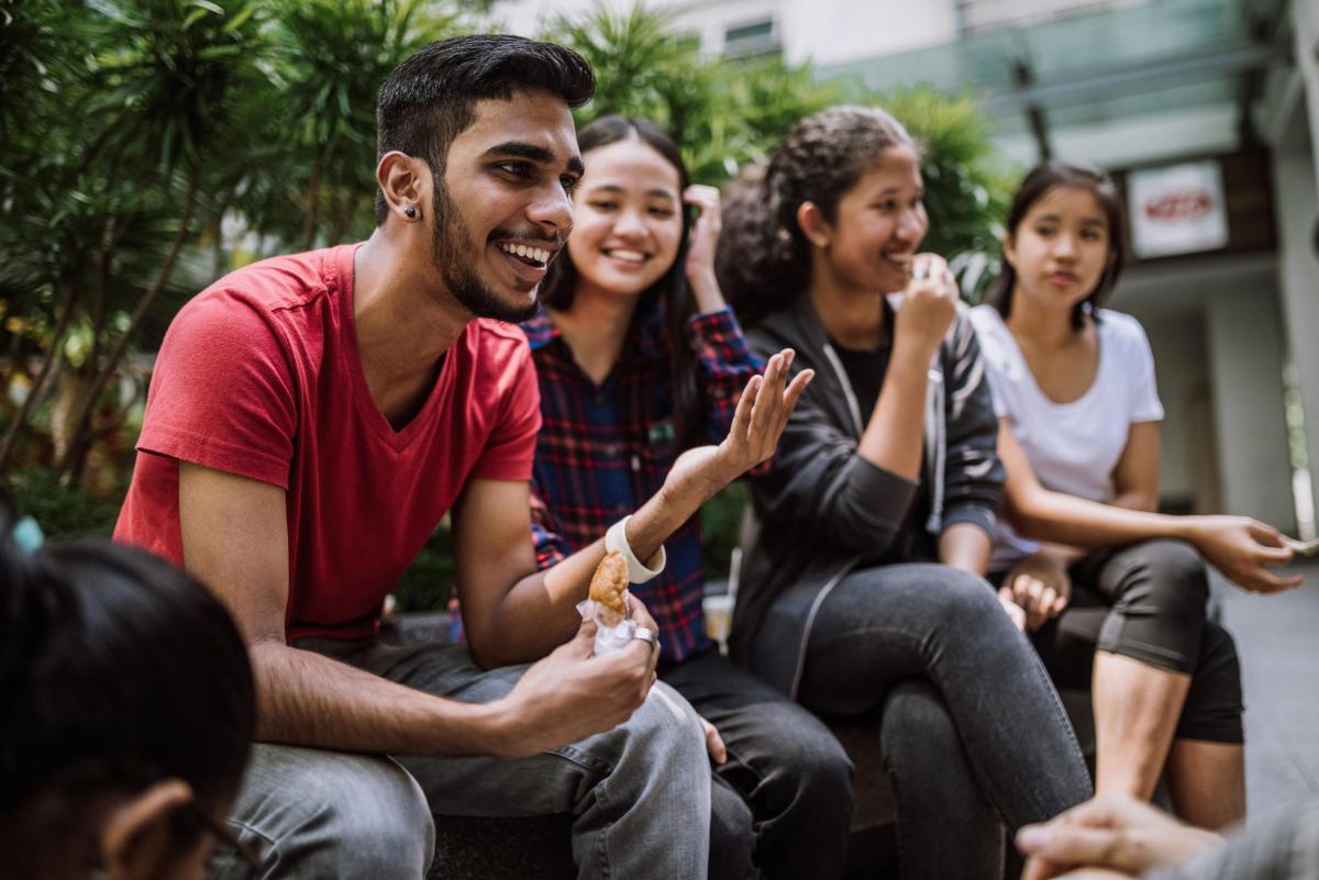 Image of young people sitting together