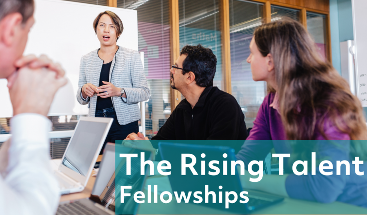 Rising Talent Fellowships - Four staff members at presentation with one person speaking