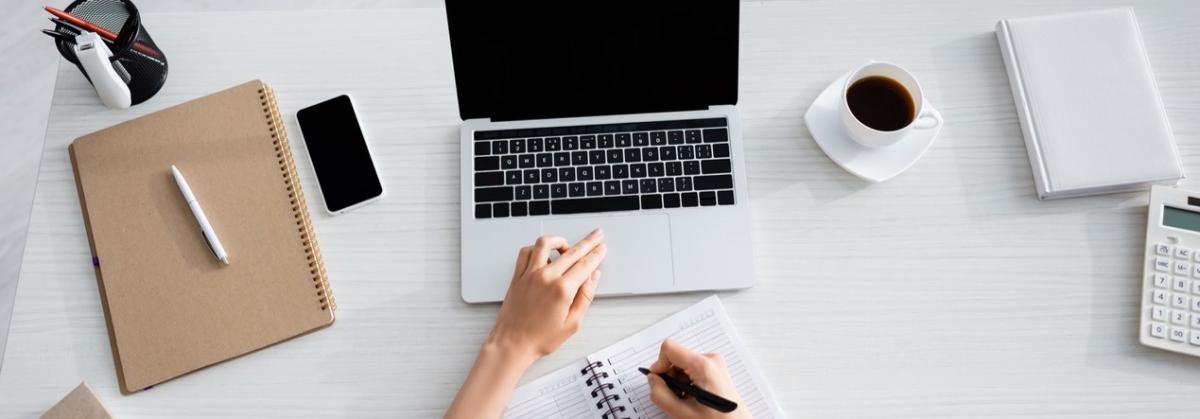 desktop with laptop, notebook, coffee