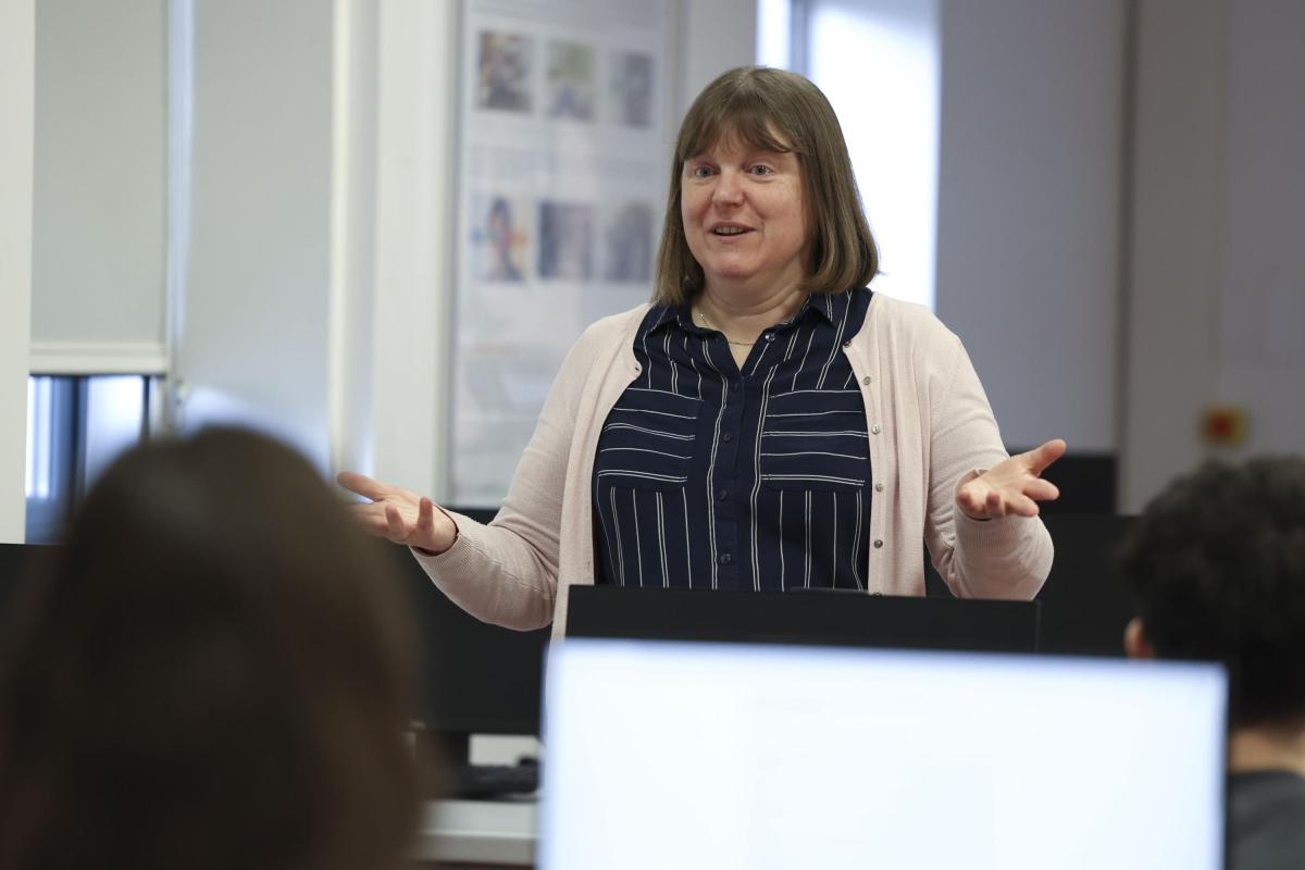 Shows doctor Louise Hopper speaking to students