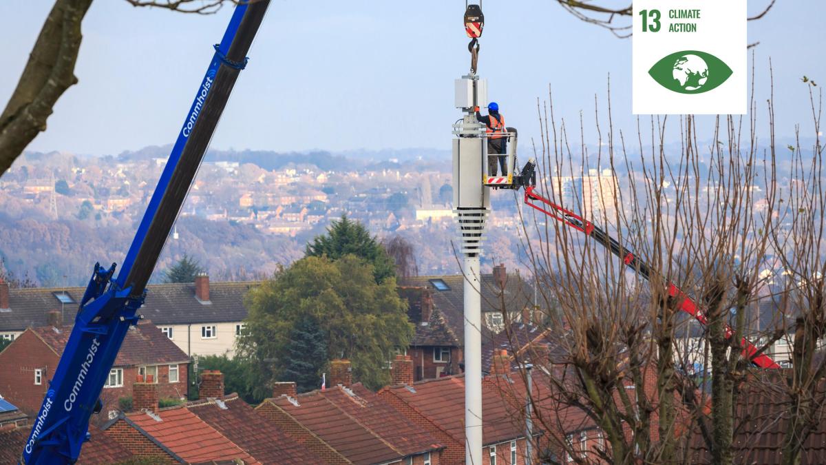 Shows a technician installing a sensor in London, UK