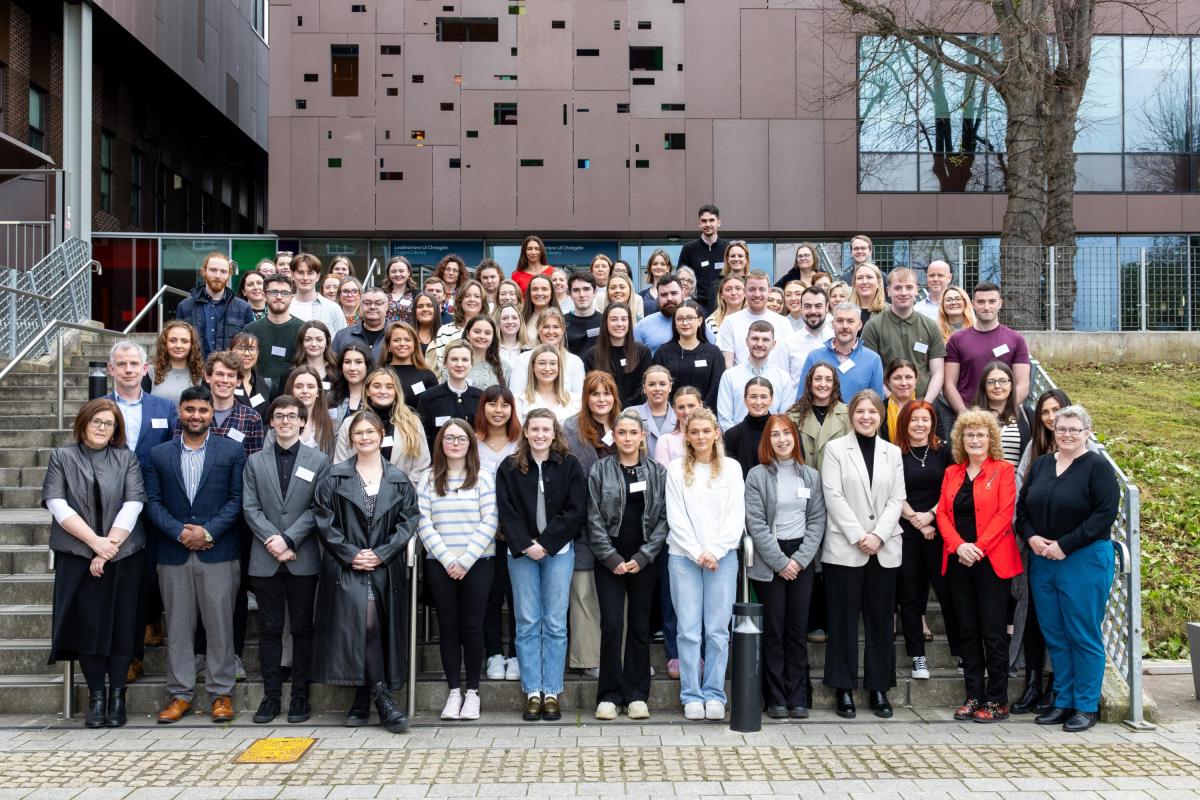 A group shot of the attendees at the STInt Meet and Greet 2024, taken outside on the DCU St. Patrick's Campus