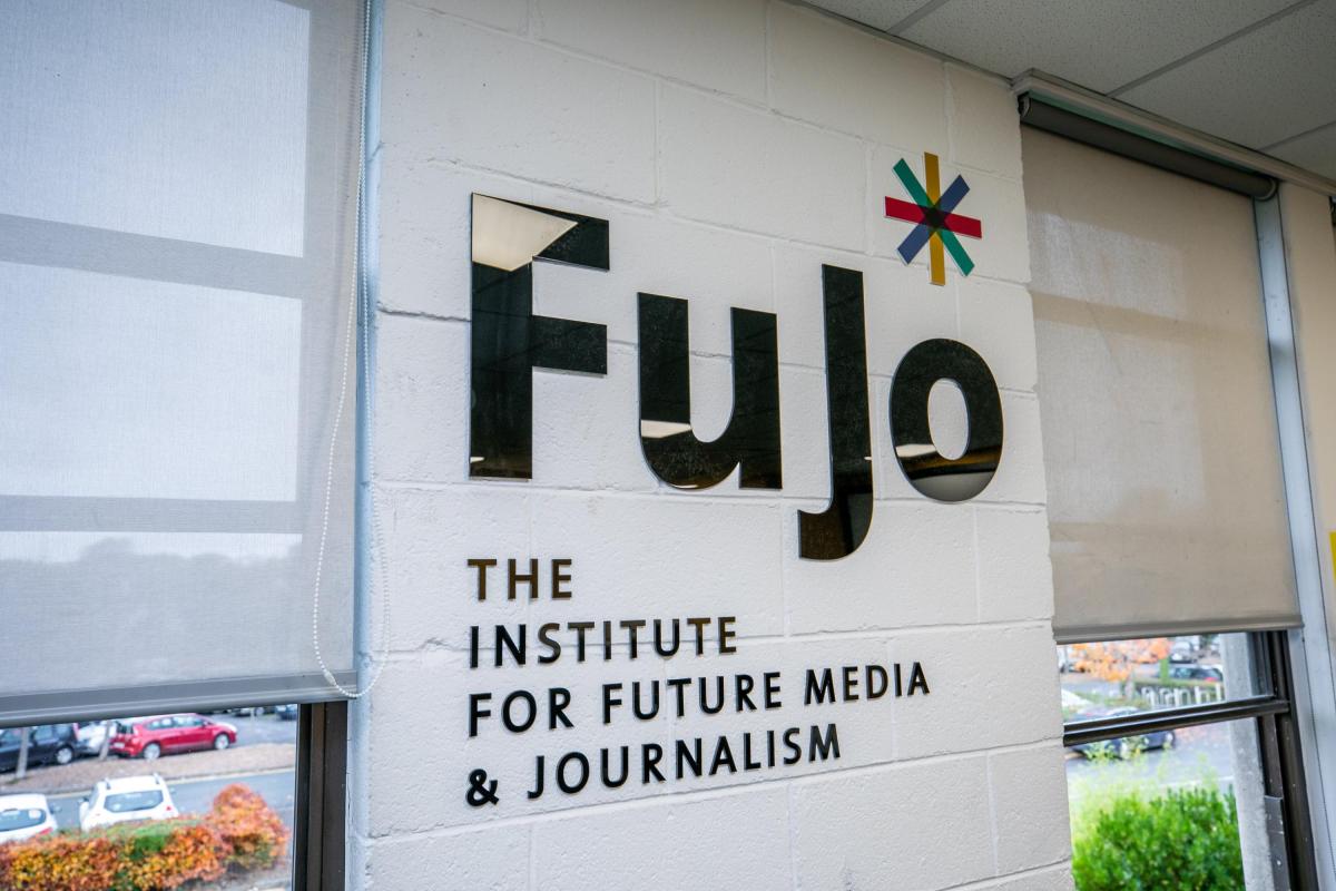 Photo of a wall showing the letters 'Fujo' with the acronym spelled out below; "The Institute for Future of Media and Journalism"