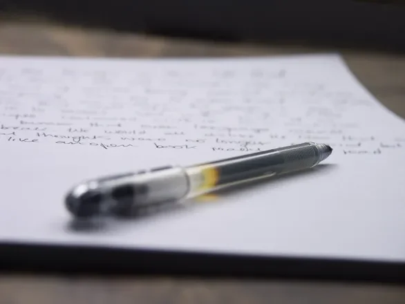 Image of a pen and paper.