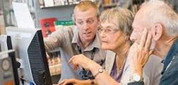 Older people looking at computer screen