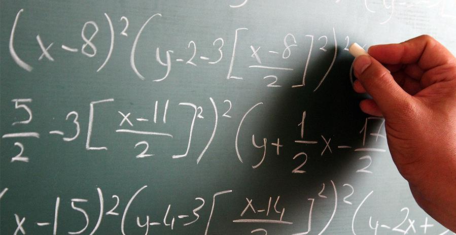 Mathematics equation on a chalk board