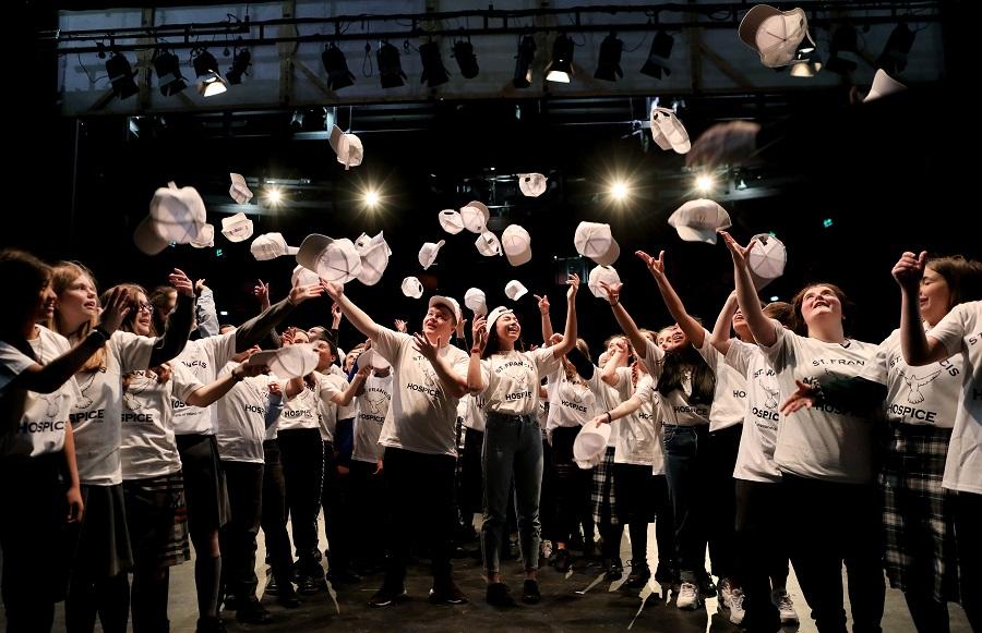 DCU Access Schools Choir prepares to take the stage at Dublin City University in aid of the St. Francis Hospice