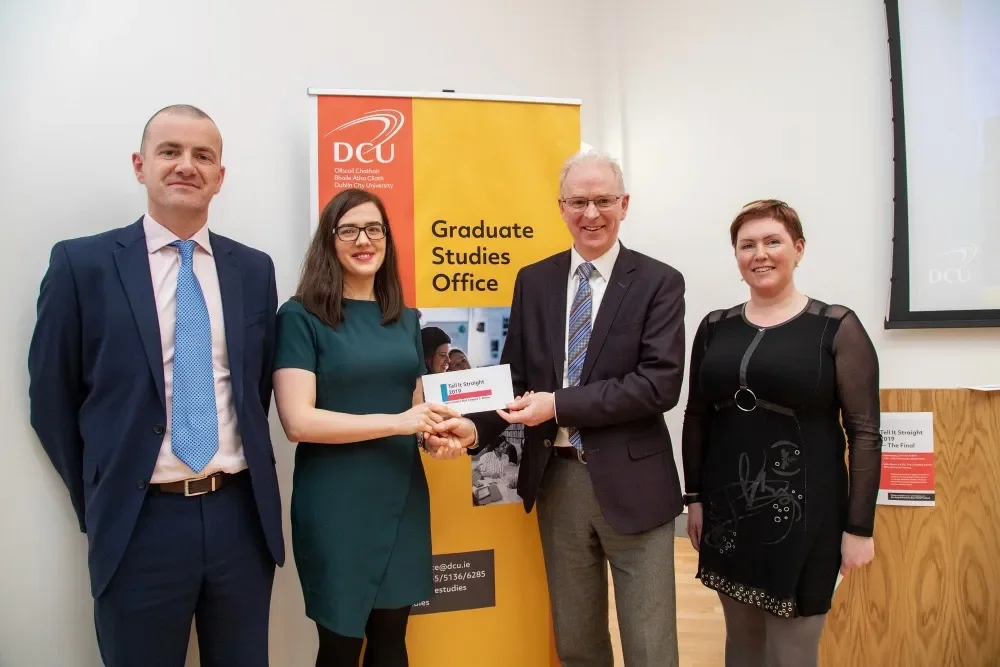 Paula receiving her prize from Prof. Greg Hughes