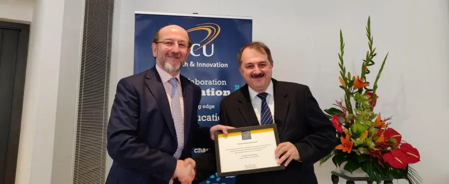Dr Gabriel-Miro Muntean, School of Electronic Engineering, receiving his Research Award from Prof. Brian MacCraith, President of