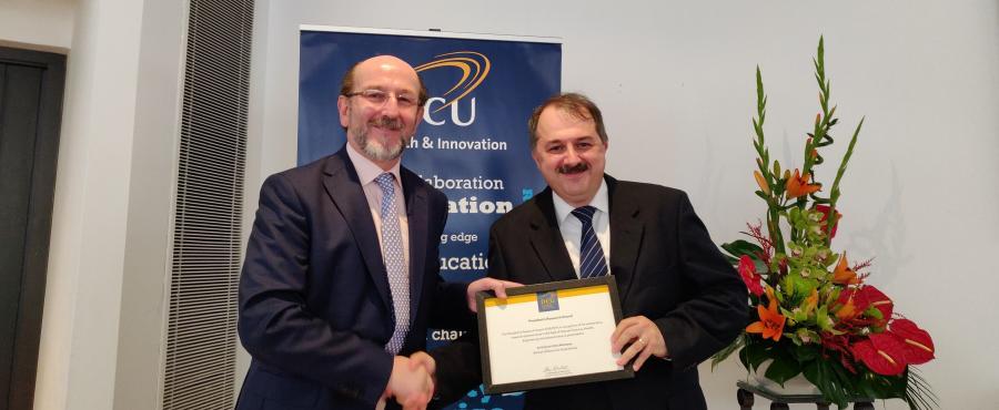 Dr Gabriel-Miro Muntean, School of Electronic Engineering, receiving his Research Award from Prof. Brian MacCraith, President of