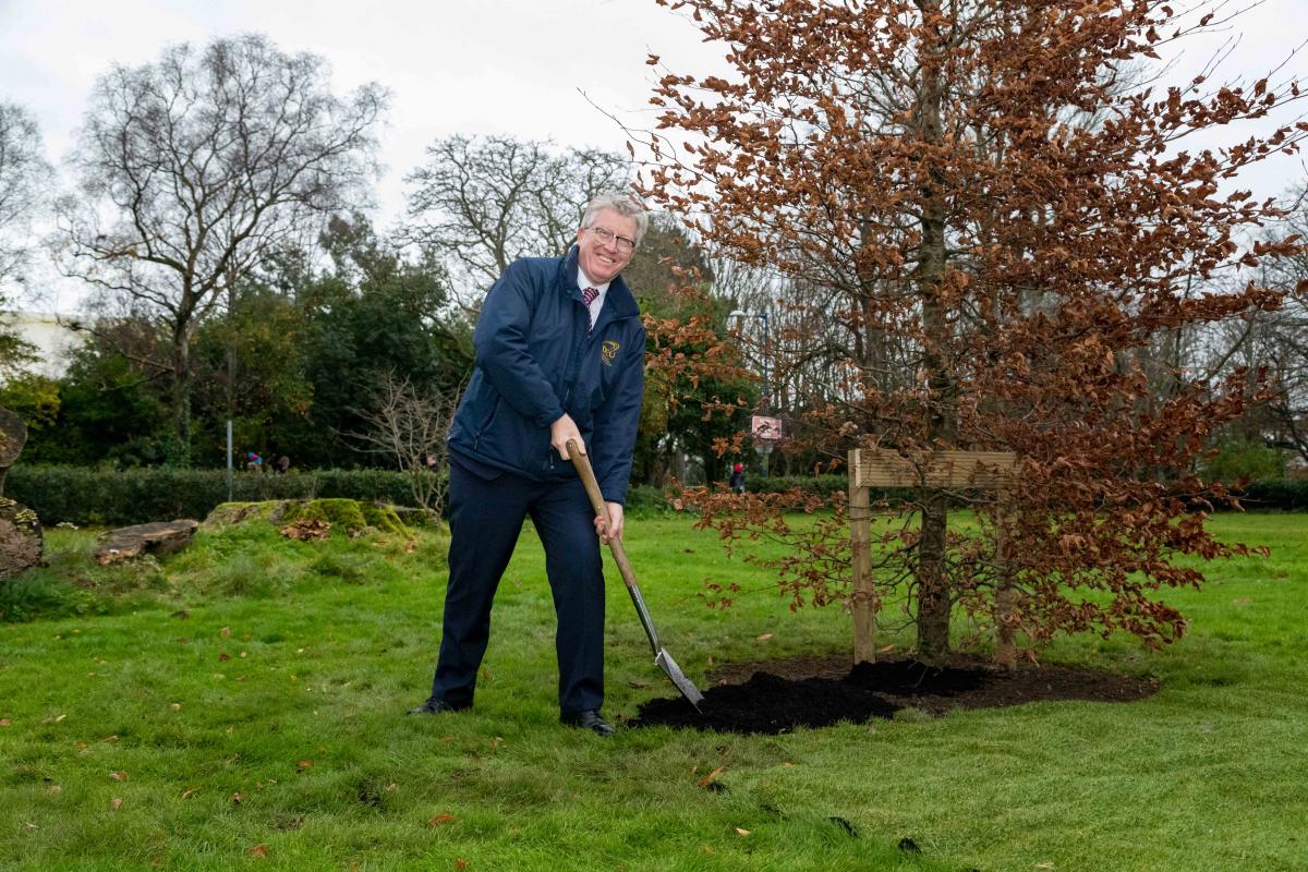 Deputy President Professor Daire Keogh at a tree planting ceremony outside Albert College