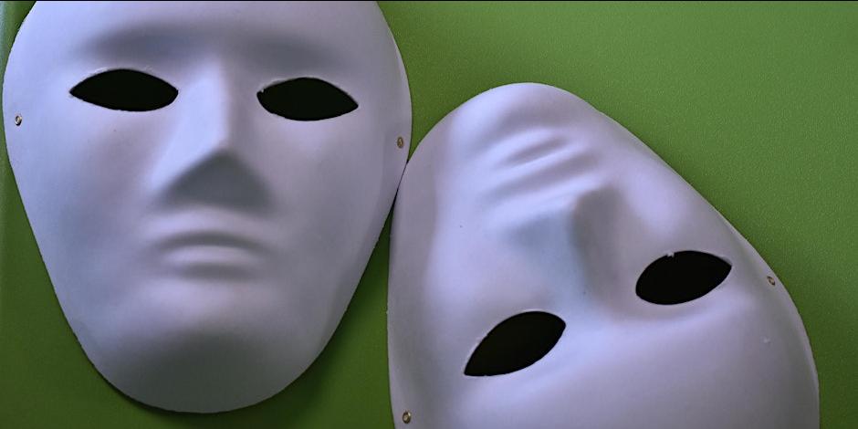 Shows two white masks associated with drama 