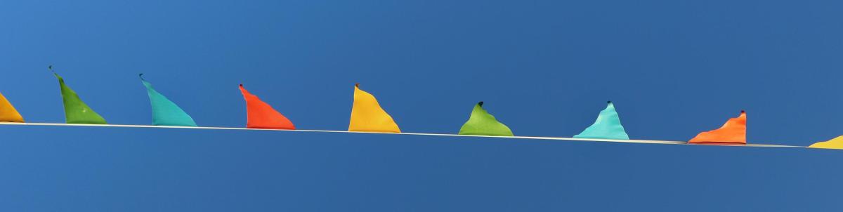 A line of coloured flags in the sky