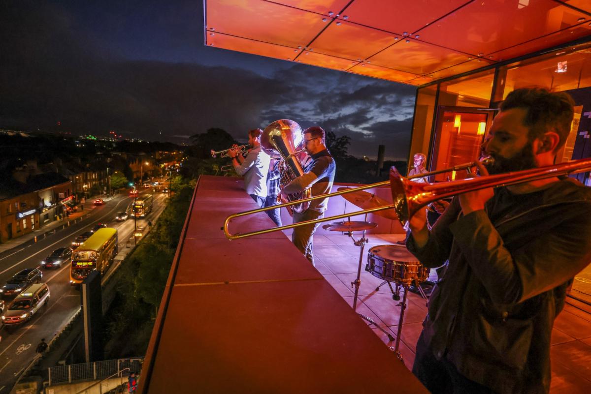 Stomptown Brass playing on the balcony of Cregan Library for Culture Night